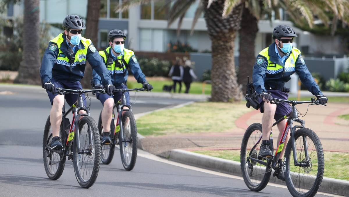 The significant police operation near Flagstaff Point, Wollongong includes cops on bikes patrolling the area for those breaching the public health order. Picture: Adam McLean
