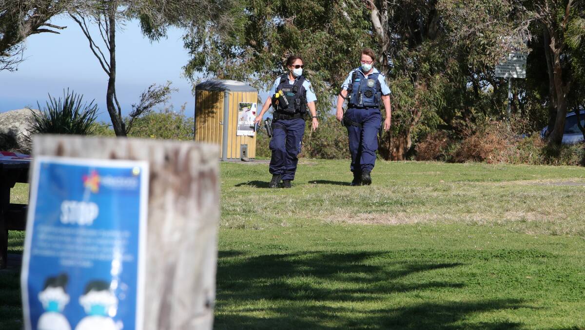 People are stopped by police during a COVID compliance check at Killalea State Park on Monday, August 23. Picture: Sylvia Liber. 22 