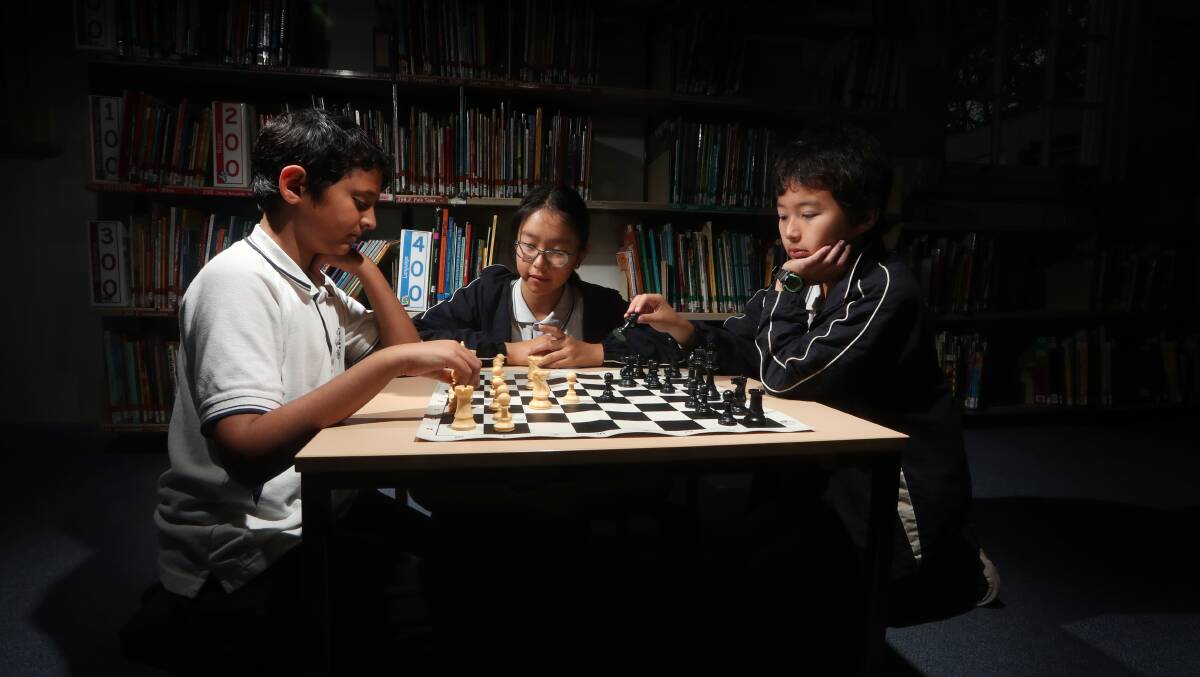 CURIOUS MINDS: Rahil Shaikh, Christine Chang, Han Tait and Nazif Sohel (missing) helped Wollongong Public School win the NSW Regional Inter Schools’ Chess Tournament. Picture: Sylvia Liber.