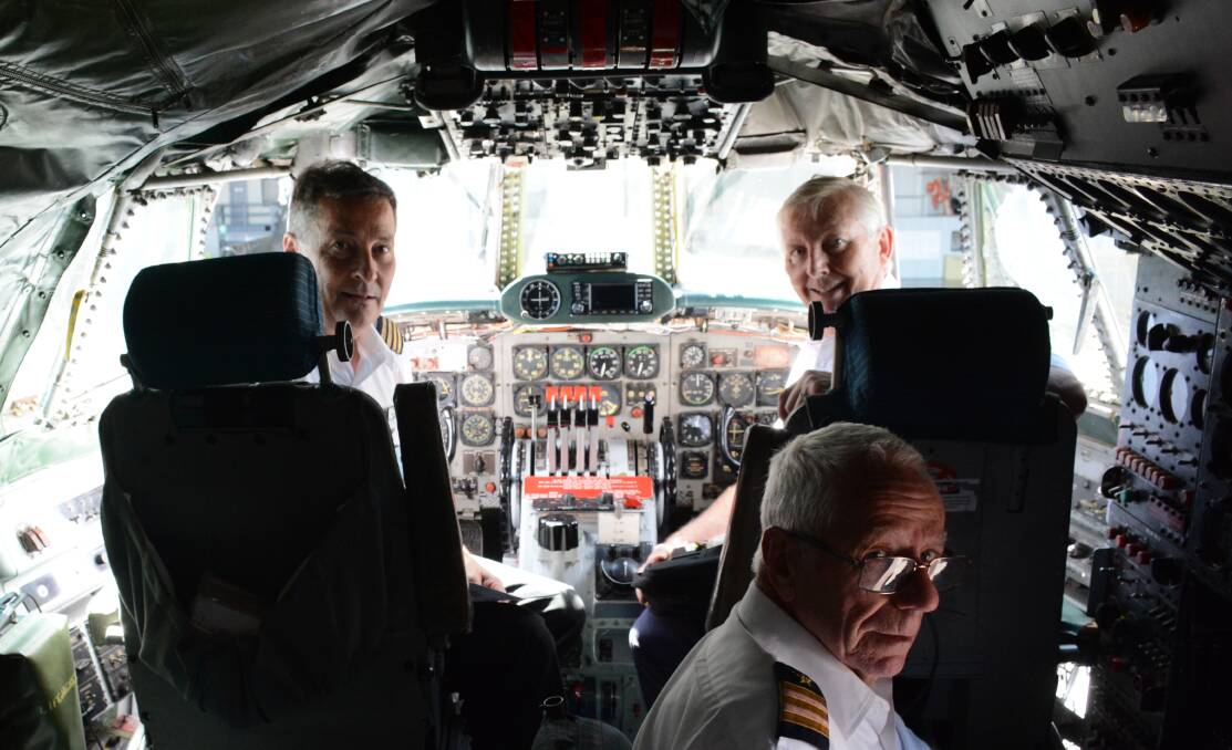 BOYS WITH TOYS: Ross Kelly, Bob De La Hunty and Warren Goodhew at the helm of one of two Constellations left in the world. Picture: Desiree Savage