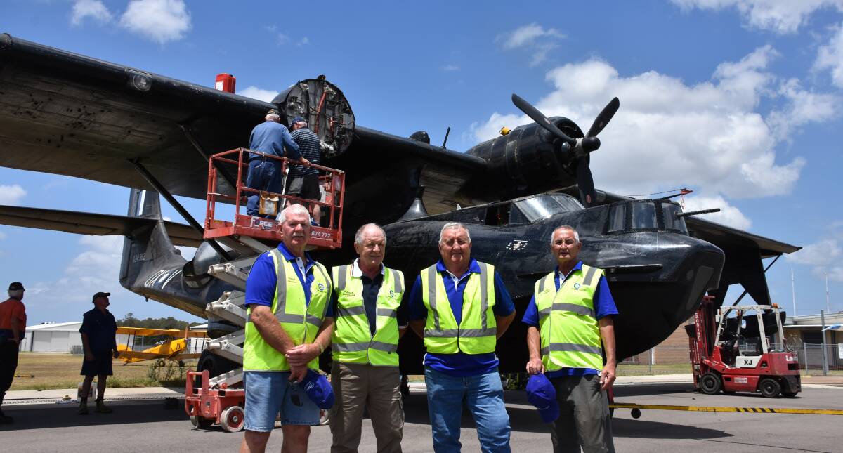 NEARLY READY: RCMPA's Terry Woolard, Warren Easterbrook, John Collins and Bruce Ferguson with the plane. Picture: Lachlan Leeming. 