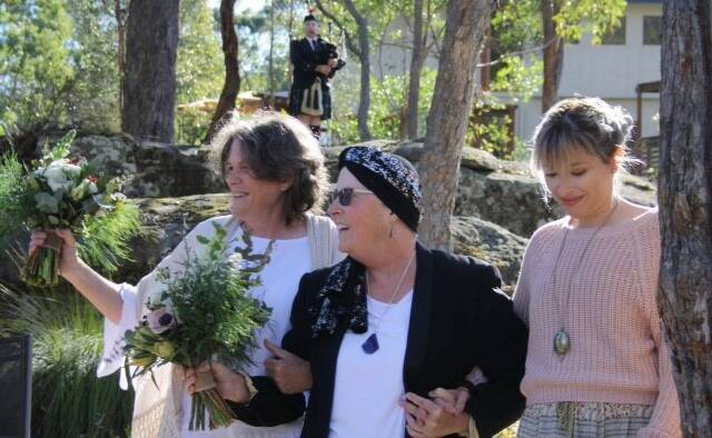 Trisha Milne and Karen Russell with their daughter Erin Milne on their wedding day on September 20. 