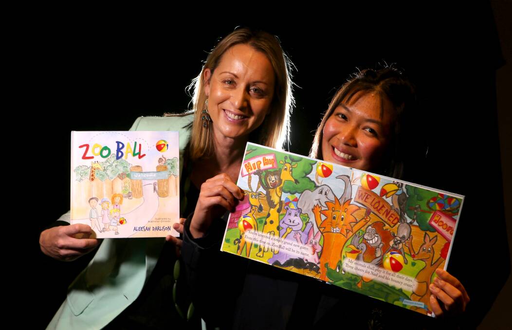 IMAGINE: Children's author Aleesah Darlison with 17-year-old Fern Sutiyawan and the double-page she illustrated for Zoo Ball. Picture: Sylvia Liber