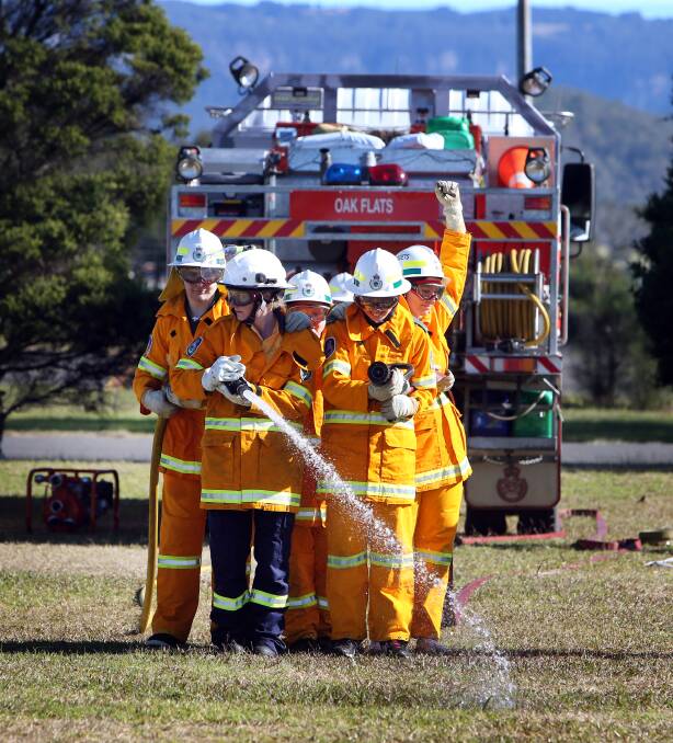 FIRED UP: Students from Kanahooka High School's support unit graduated from the NSW Rural Fire Service School Cadet Program on Wednesday.Picture: Sylvia Liber