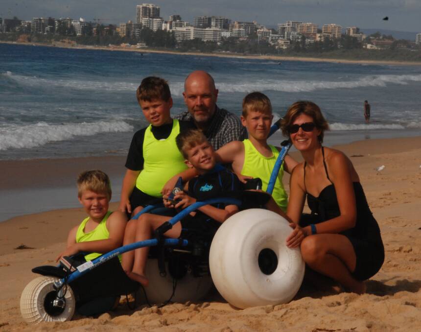 ACCESSIBLE: Lucas, Alex, Brendan, Samuel, Katrina and Jacob Carroll with the new beach wheelchair Jacob uses.  Picture: Lisa Johnson