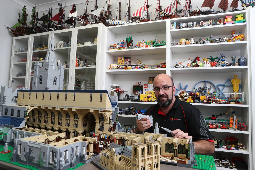 SHOW TIME: Dapto's Graham Draper, founder of GongLUG, at work on one of his many LEGO displays. Picture: Robert Peet