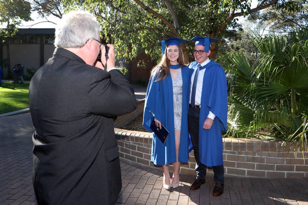 OCCASION: Ash Gesler and Tom Harding being photographed by Chris Harding on Wednesday. Picture: Sylvia Liber