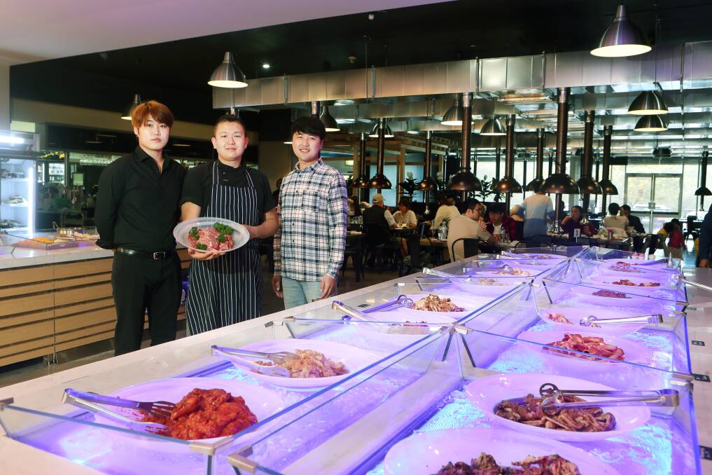 POPULAR: Lance Jo, restaurant manager with chef Jin Jun and Minwoo Choi, managing director at the new Korean barbecue restaurant. Picture: Sylvia Liber