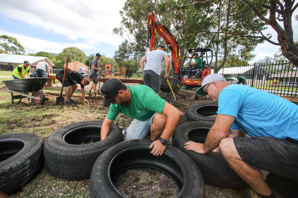 VOLUNTEERS: Dave Morris and Mick Zietsch helping Fathers of Russell Vale Kids (FORKS) to build an outdoor learning centre at Russell Vale Public. Picture: Adam McLean