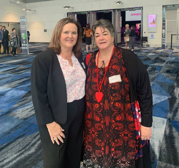 RECOGNISED: Kim Sattler (right) was named the 2021 Shellharbour Local Woman of the Year by Member for Shellharbour Anna Watson (left) on Wednesday.