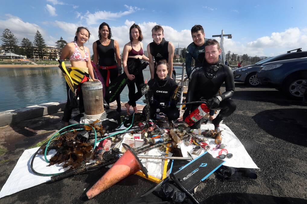 CLEANING UP: Event organiser Sandra Dohring with (back, left to right), Ayaka Moritsugu, Melanie Meredith, Sarah White, Michael Burns, Hunter Gambuzza and Paul Copson at Wollongong Harbour. Picture: Robert Peet