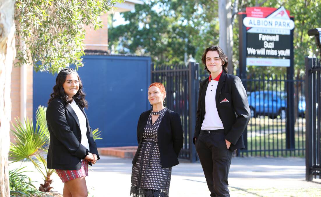 EDUCATOR: Suzi Clapham, principal of Albion Park High School, is retiring after 37 years as an educator in the NSW public school system. She's pictured with school captains Latai Kinikini and Cooper Dawson. Picture: Sylvia Liber