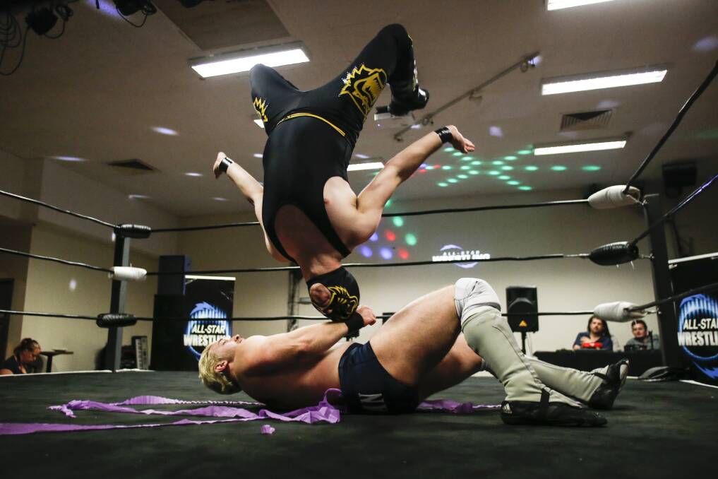 ACTION: Lee 'The Man' Morrow and El Jaguar in action at the All-Star Wrestling event at Illawarra Leagues Club. Picture: Anna Warr