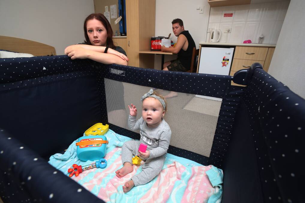 ACCOMMODATION: Chloe Harris and Tyler Subotic with daughter Willow in their temporary accommodation on Friday. Picture: Robert Peet