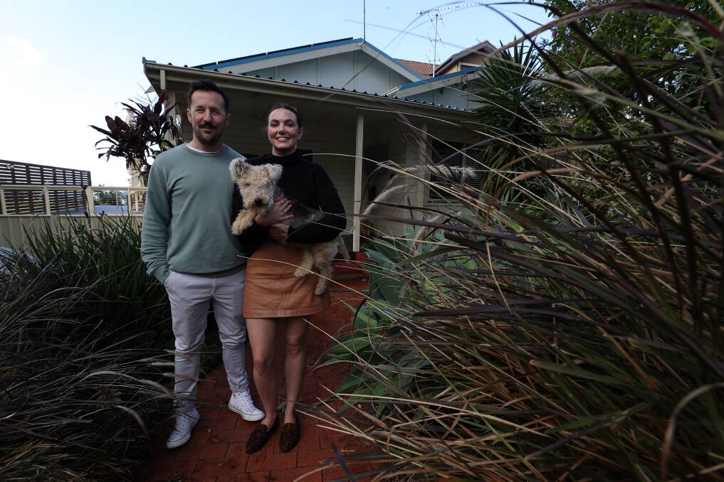 Morris Bryant and partner Bek Fraser (pictured with their dog Ted Danson) at their Wombarra home. Picture: Robert Peet