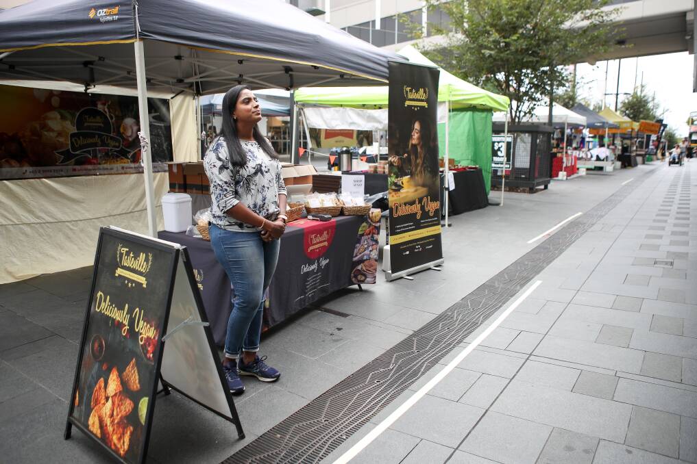TO MARKET: Sydney-based stall-holder Sudha Diwakar selling traditional south Indian crackers at the markets in Wollongong's mall in late March. Picture: Adam McLean