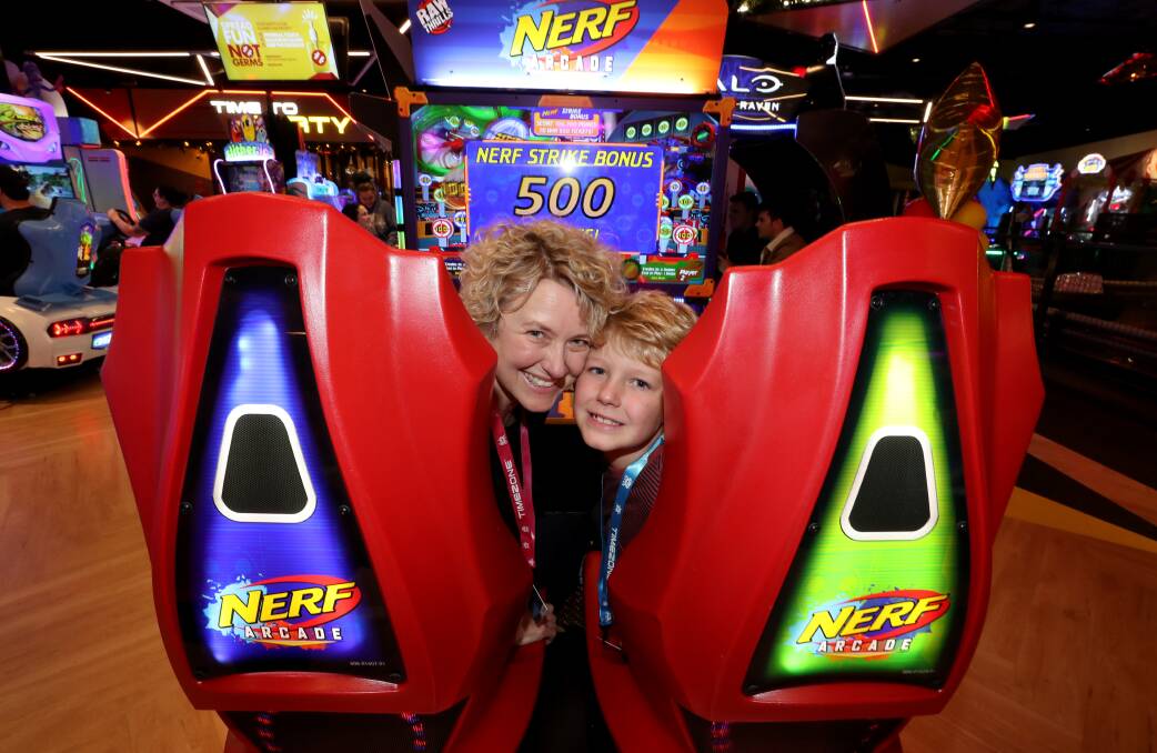 FAMILY FUN: Bianca Tulich with her son Oscar Carter at the new Timezone at Stockland Shellharbour. Picture: Robert Peet 