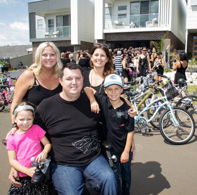 HELPING HAND: Ride organiser Cassy Peters with Adam Regal, his wife Kylie and their children Ciara and Ajai. Picture: Georgia Matts