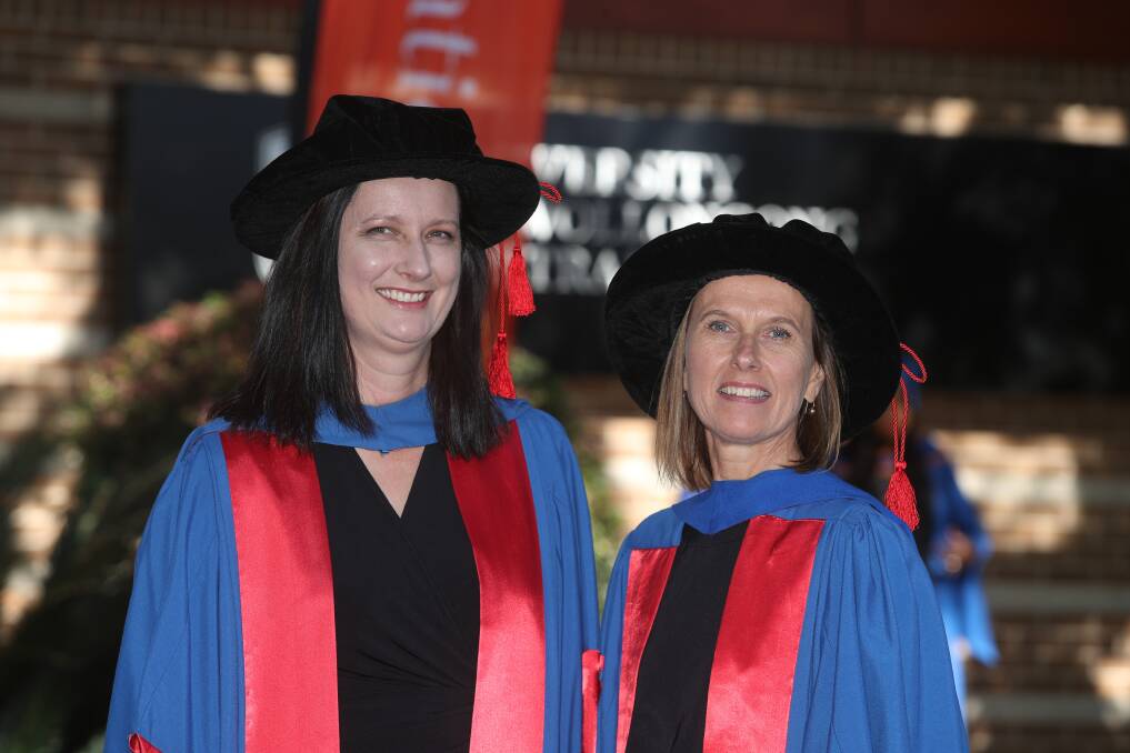 GREAT ACHIEVEMENT: Dr Megan Hammersley and Dr Jennifer Norman at the UOW graduation ceremony on Thursday. Picture: Robert Peet