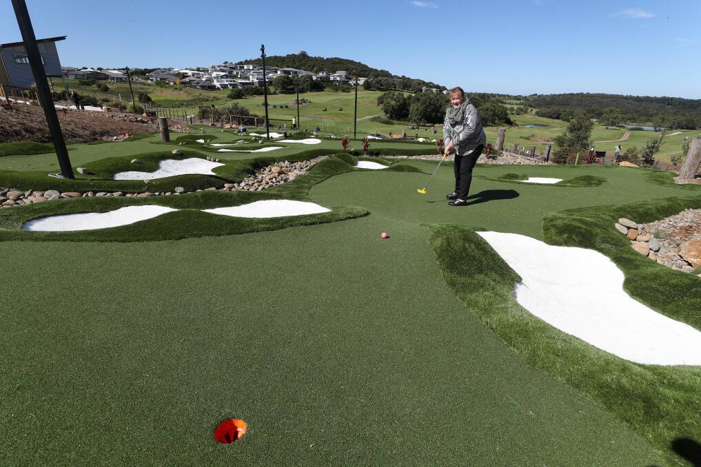 NEW COURSE: Shellharbour Mayor Marianne Saliba testing out the new mini golf course located at The Links Shell Cove. Pictures: Robert Peet