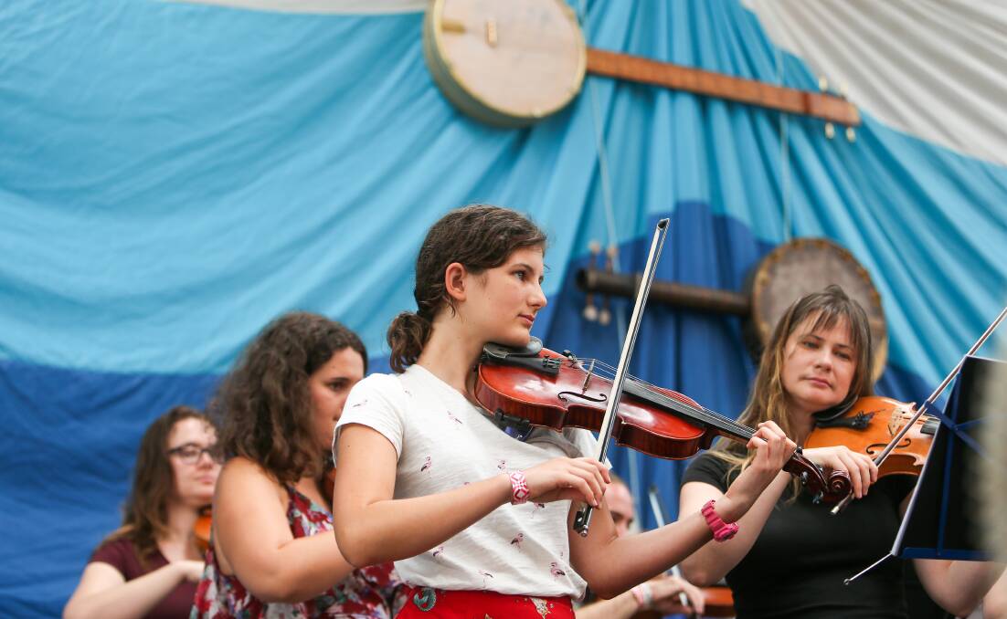 ANNUAL EVENT: Folkaphonic Youth Orchestra members performing on the main stage of the Illawarra Folk Festival. Picture: Adam McLean