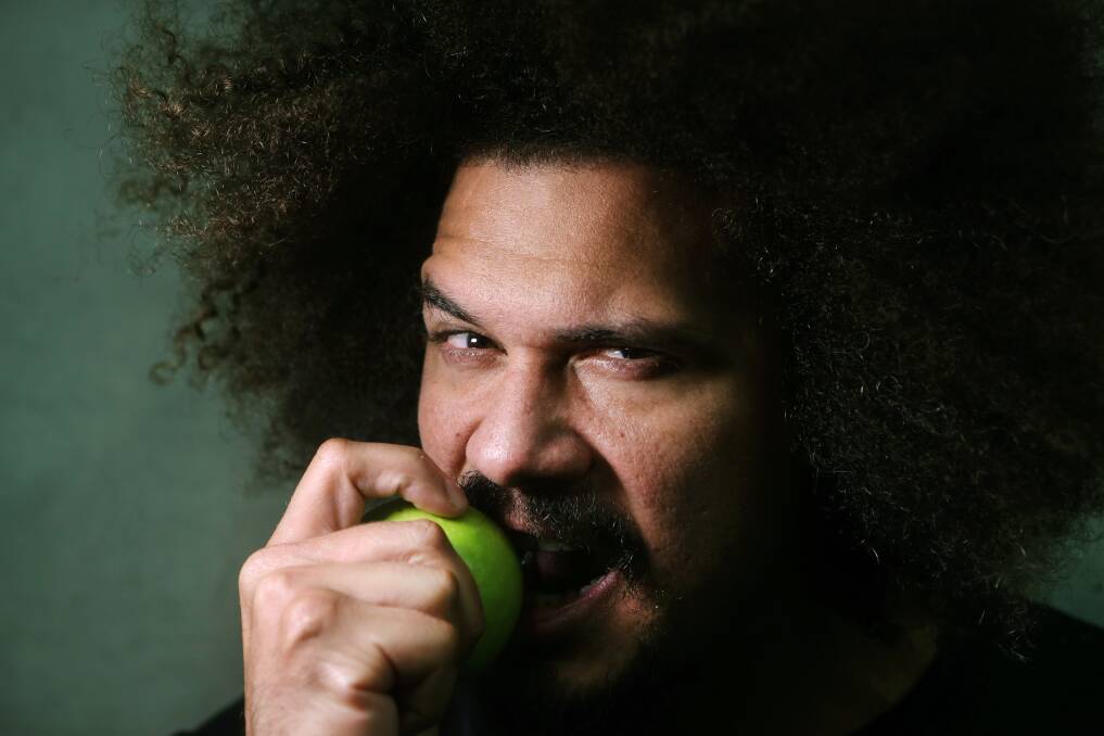 GRAPPLING WITH SUCCESS: Former WWE star Carlito with his trademark apple, ahead of his Wollongong appearance. Picture: Sylvia Liber 
