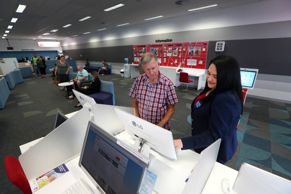 KEY SERVICE: Paul McShane with Aleesha Poidevin, a 'Cost of Living' specialist, at the Warrawong Service Centre on Tuesday, as part of the statewide roll-out of the initiative. Picture: Sylvia Liber