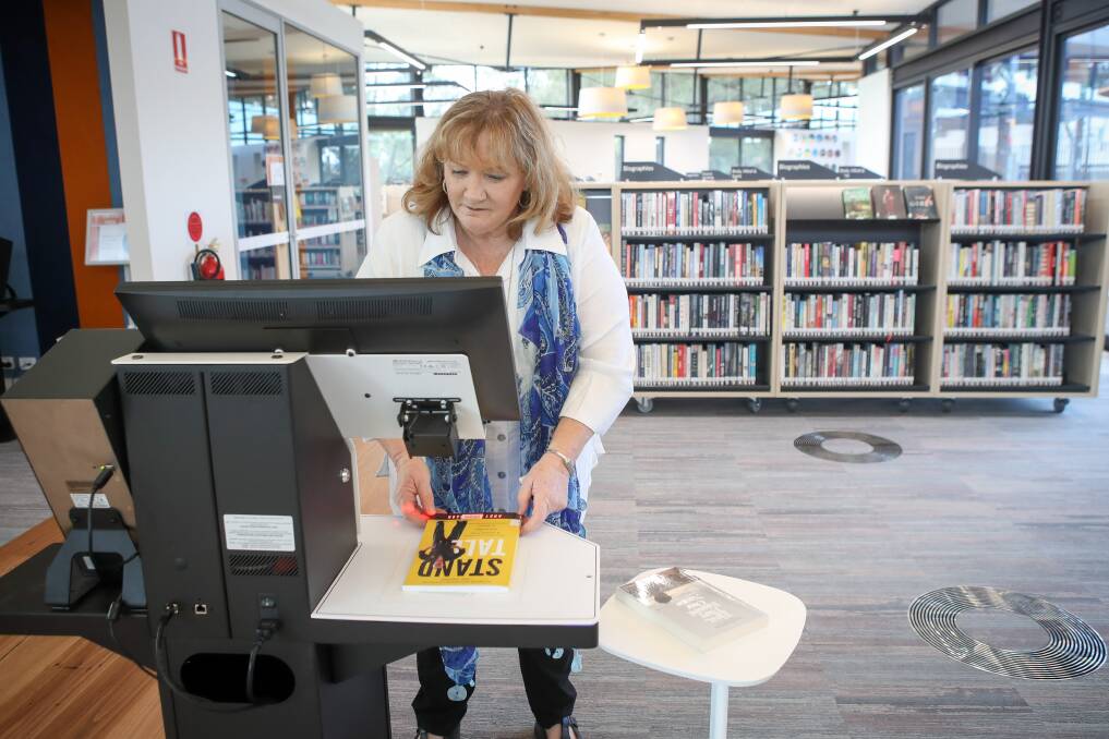 KEY SERVICE: Shellharbour Mayor Marianne Saliba using the self-checkout system at Warilla Library. Picture: Adam McLean