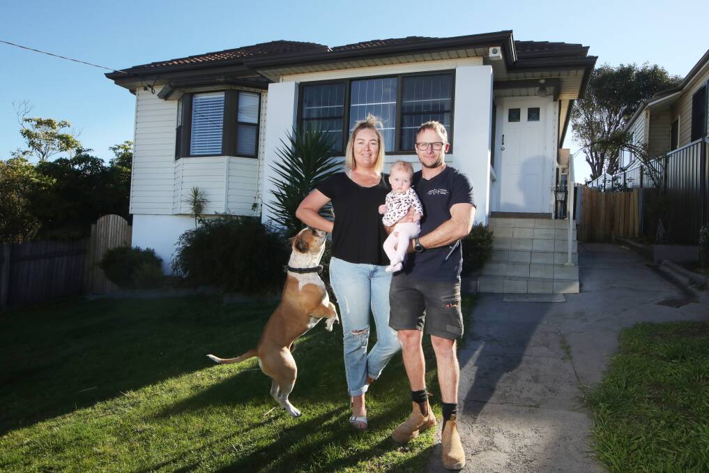 HOME: Steven Shaw, Louise Shaw, daughter Grace and dog Rupert at their home in Warrawong. Picture: Sylvia Liber
