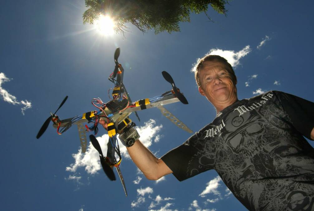 CREATIVE: Photographer Noel Downey with his helicopter camera set-up in 2010. Picture: Dave Tease