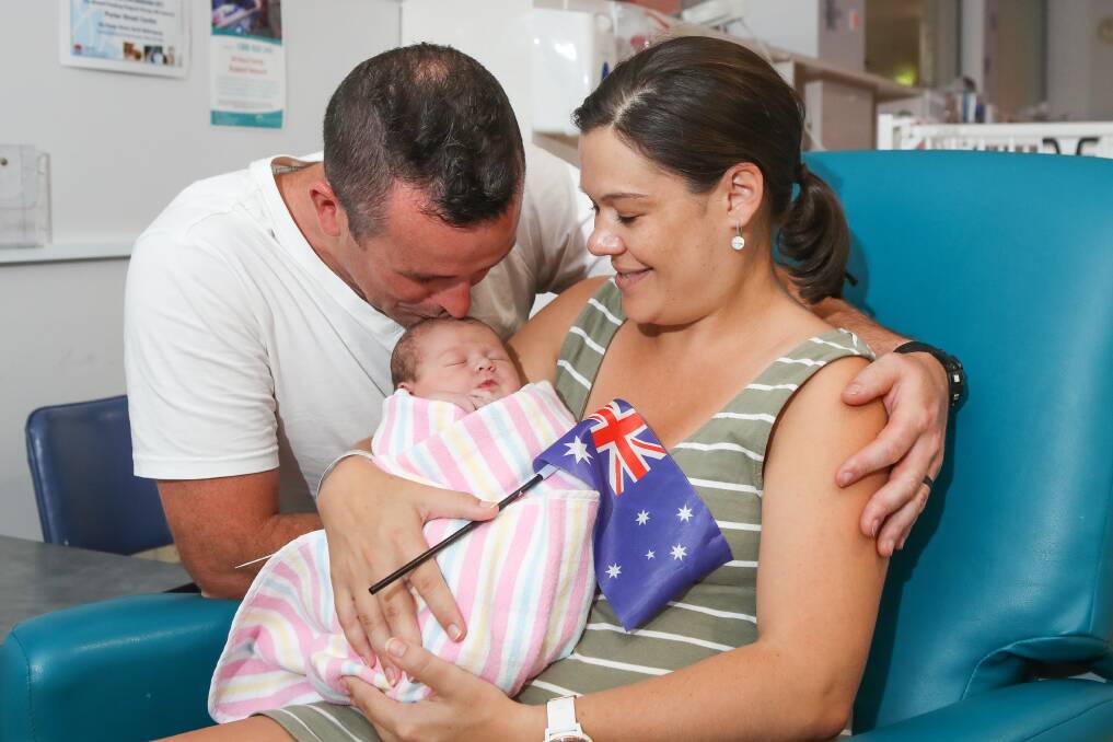 NEW ARRIVAL: Figtree couple Sally Hill and Drew Pullen with their newborn on Monday. Picture: Adam McLean