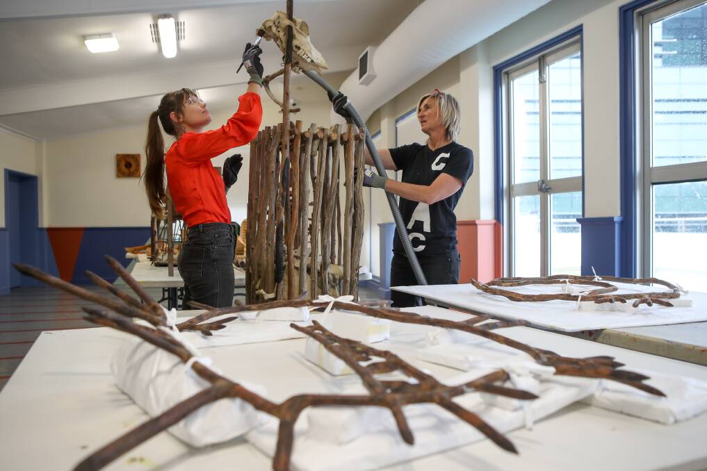WORKS: Intern Xanthe Barker with Wollongong Art Gallery technical officer Milly Hyde, cleaning and restoring some of the gallery's artwork collection. Picture: Adam McLean
