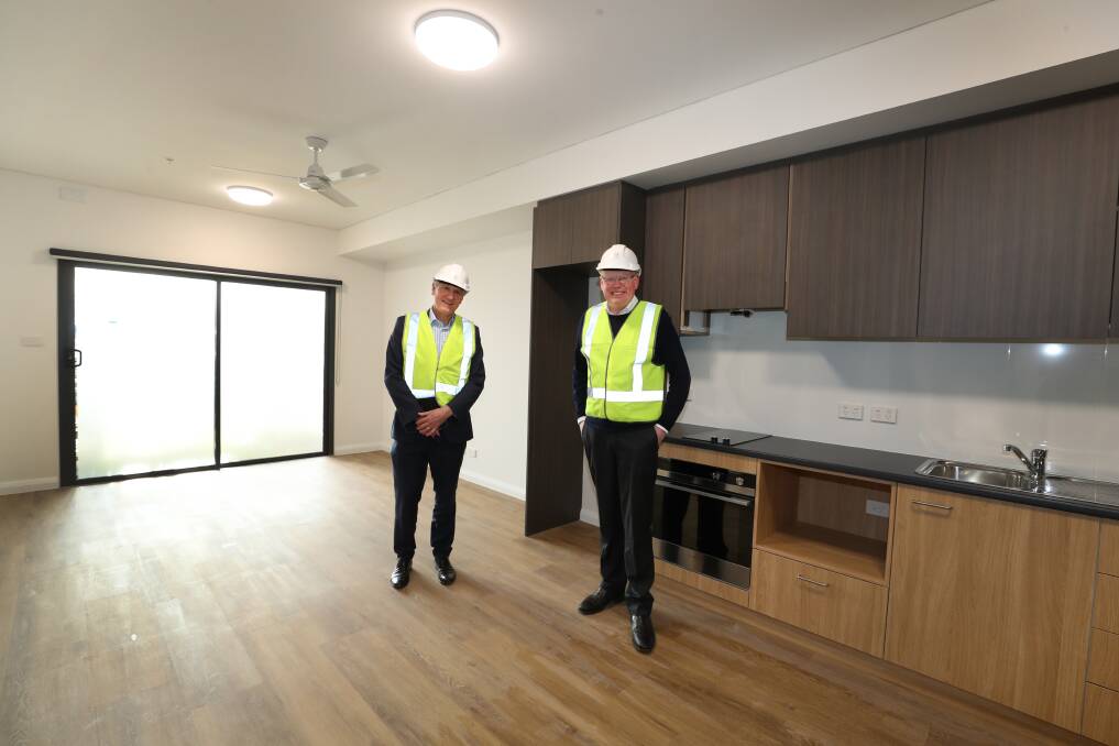 PROJECT: Anglicare's Bill Farrand and Minister for Families, Communities and Disability Services Gareth Ward at the complex being built in Corrimal. Picture: Robert Peet