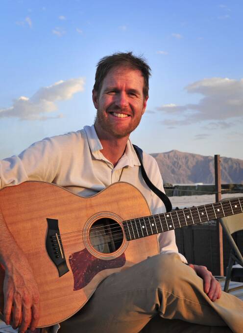 PERFORMING: Fred Smith, pictured in Afghanistan where he was an Australian diplomat attached to the Australian forces. Picture: Supplied