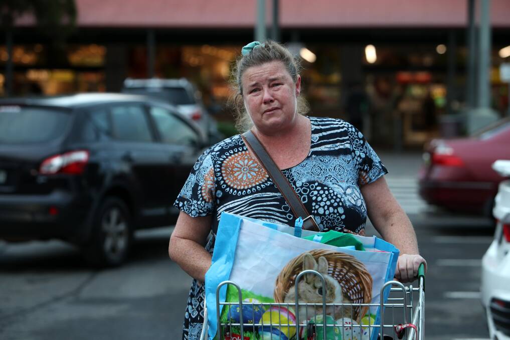FRUSTRATED: Albion Park single mother and carer Deborah Burrows was among an estimated several hundred people who attended the Woolworths store at Albion Park early on Tuesday morning. Picture: Sylvia Liber
