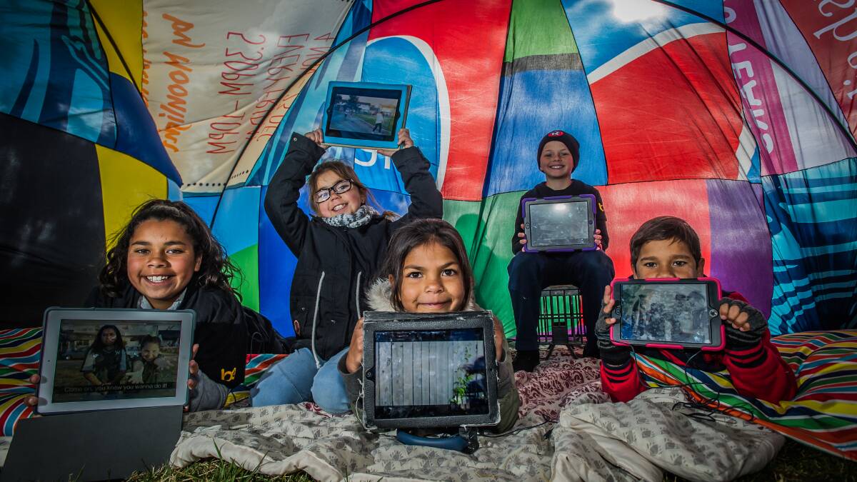 Young Illawarra film-makers in their pop-up cubby on the lawns of Parliament House. Pictured are Nicole Brown,12, Nyetarlee Jackson, 8, Vicky Thomas, 8, Cooper Magarelli,10, and Drew Brown, 9. Picture: Karleen Minney