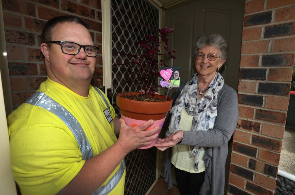 MOTHER'S DAY: The Greenacres IRT Community Connect gardening crew are delivering pot plants as surprise Mother's Day gifts. Pictured is Greenacres gardener Jason Boxall with IRT resident Roslyn Mackey. Picture: Robert Peet