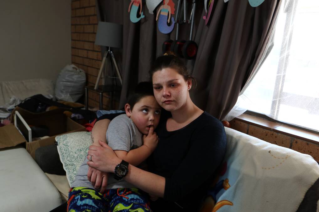 TOUGH TIMES: Katie Cochran with her son Blaan-Craig, five, in their Windang motel room earlier this week. The Oasis Motor Inn was sold last week to international investors via a Sydney-based company. Picture: Sylvia Liber