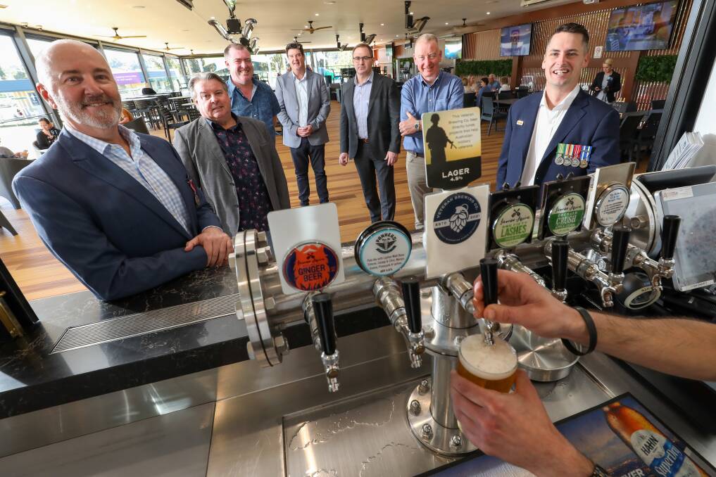 BREW FOR A CAUSE: Military veteran Tim Lewis (left) with Ross Farrell, Mark Sleigh, Greg Doyle, Michael Brennan, Graeme Sutherland and Lachlan Stevens at Figtree Sports Club. Picture: Adam McLean