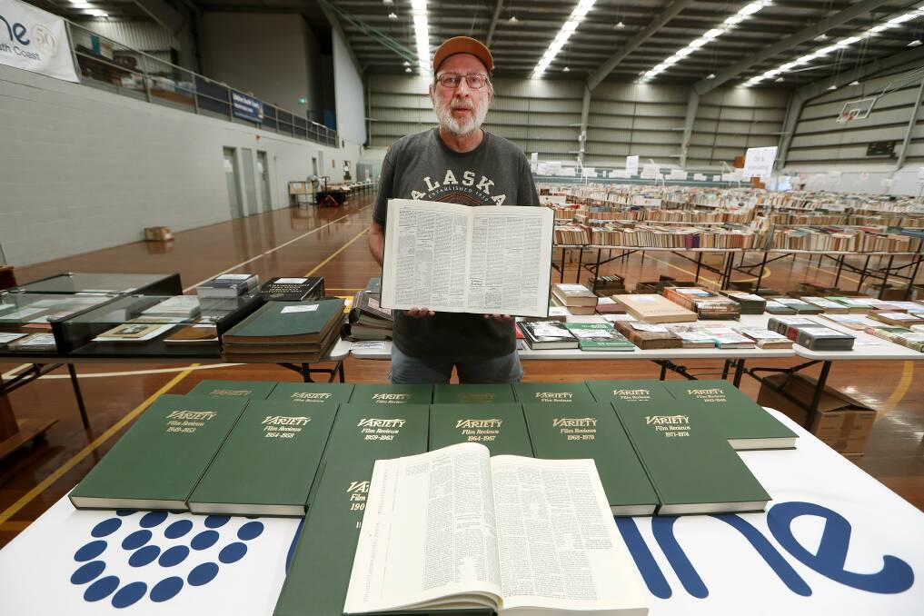 IN DEMAND: Book Fair volunteer Barry Ridding with the 'Variety Film Reviews 1907-1980' set, which can be purchased for $1600. Picture: Sylvia Liber