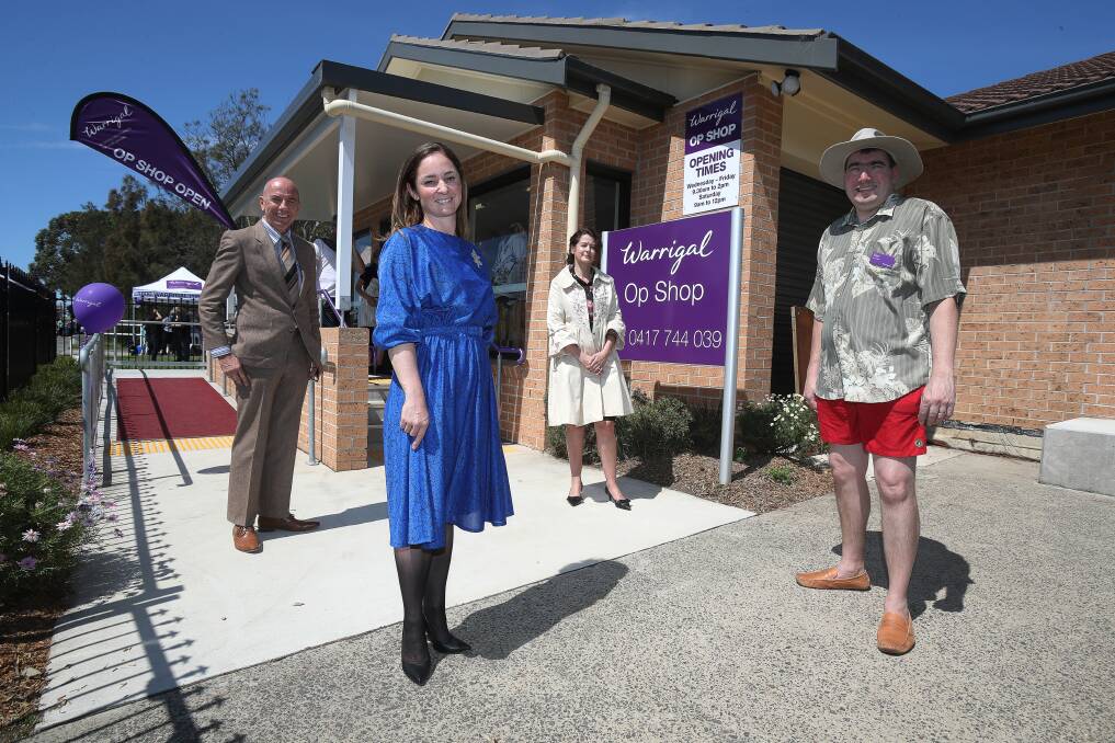SHOPPING: Warrigal executives (left to right) Mark Sewell, Alissa Walsh, Penelope Batman and Ben Marsh modelling outfits from the revamped op shop in Warilla. Picture: Robert Peet 