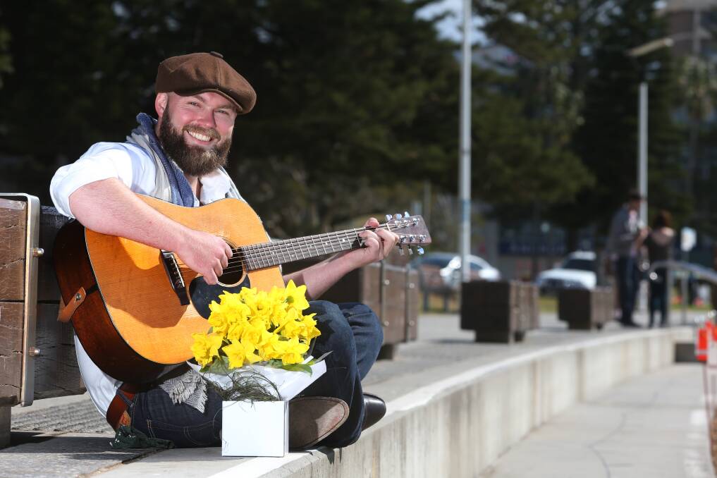 Bowen, pictured in 2018 in his role as Cancer Council ambassador, preparing to perform live at Wollongong's Friday Forage Markets for Daffodil Day. Picture: Robert Peet