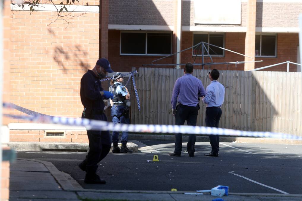 The crime scene set up after a machete attack at the Illawong Gardens public housing complex on Tuesday morning. Picture: Robert Peet