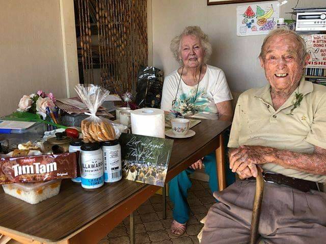 RECIPIENTS: Alec Summerside, 98, served in World War II in New Guinea. He's pictured with wife Joan at their family home at Port Kembla after the delivery of one of the respect packages. Picture: Supplied