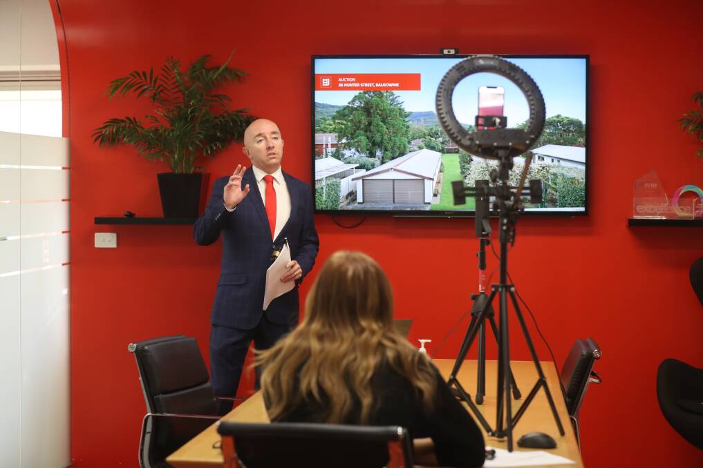 SELLING ONLINE: MMJ Wollongong auctioneer Daniel Hastings during the live-streamed auctions conducted on Saturday. Picture: Robert Peet