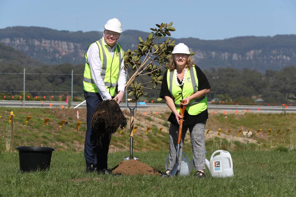 PROJECT: Gareth Ward and Marianne Saliba planting the first of a series of historically significant fig trees along a new corridor of the bypass. Picture: Robert Peet