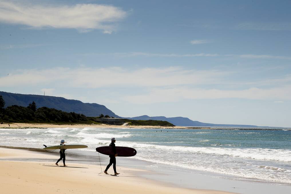 WARM DAY: Residents enjoying the conditions at Sandon Point Beach on Thursday. Picture: Anna Warr