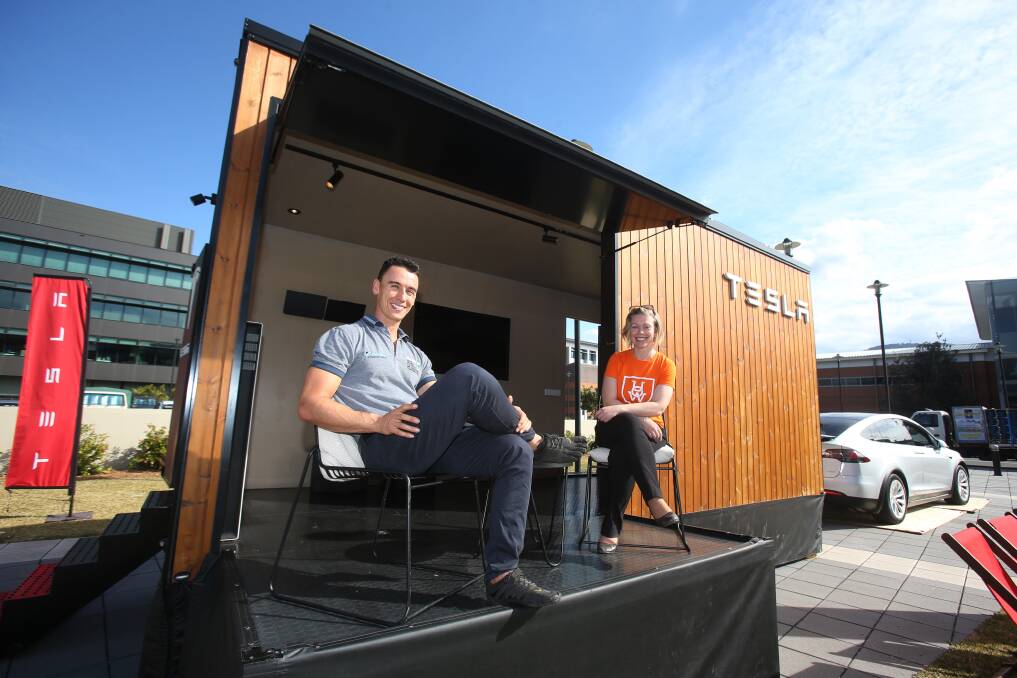 DISPLAY: Matt Simms from Simmark and Robyn Dawson from the UOW Innovation Campus with the Tesla Tiny House during its visit to the campus on Thursday. Pictures: Robert Peet