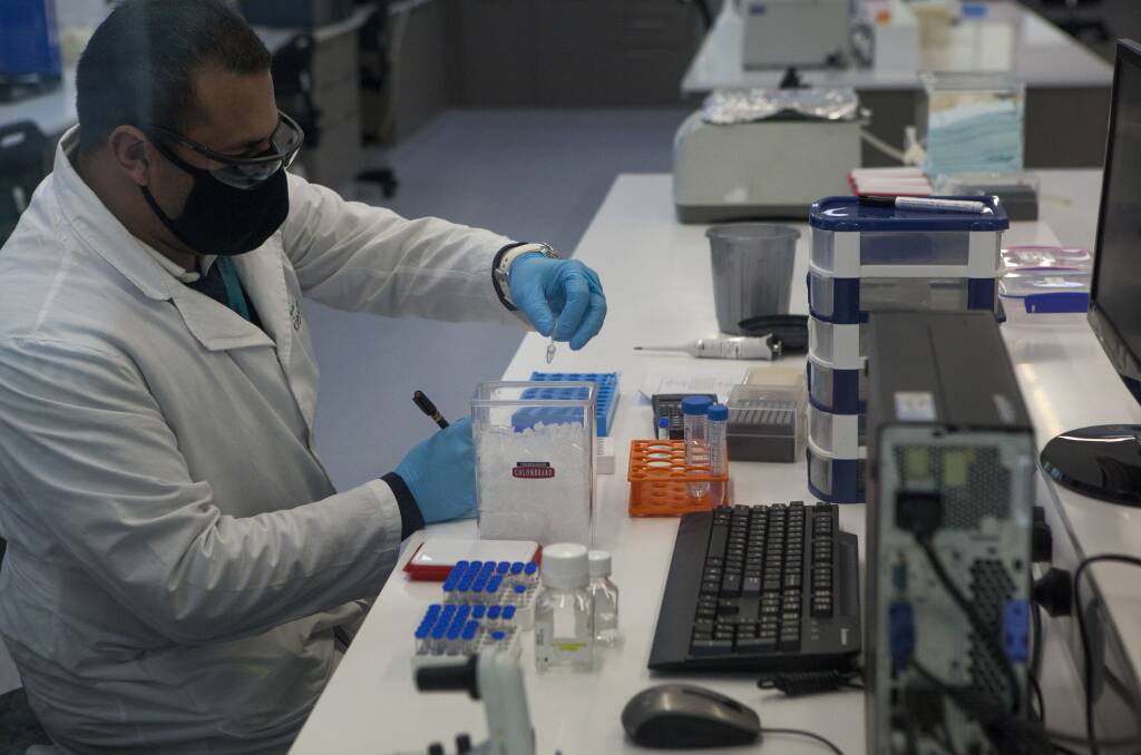 A scientist at a laboratory in Argentina, which would co-manufacture the Oxford vaccine if it is successful. Picture: Getty Images