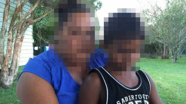 The mother with her 8-year-old son, who was allegedly locked in a paddy wagon for almost an hour. Photo: ABC News
